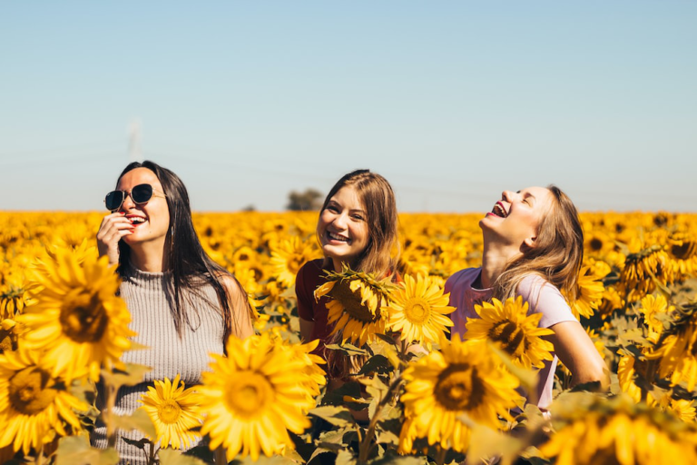 Girls in a sunflower field after getting non-surgical body sculpting