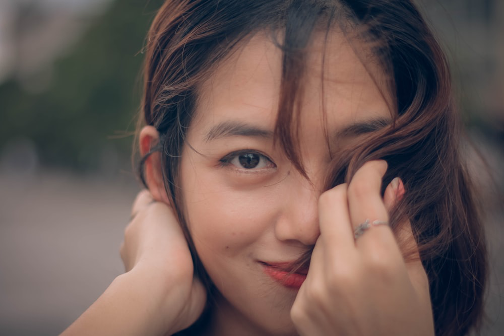 A woman’s face after body contouring treatment