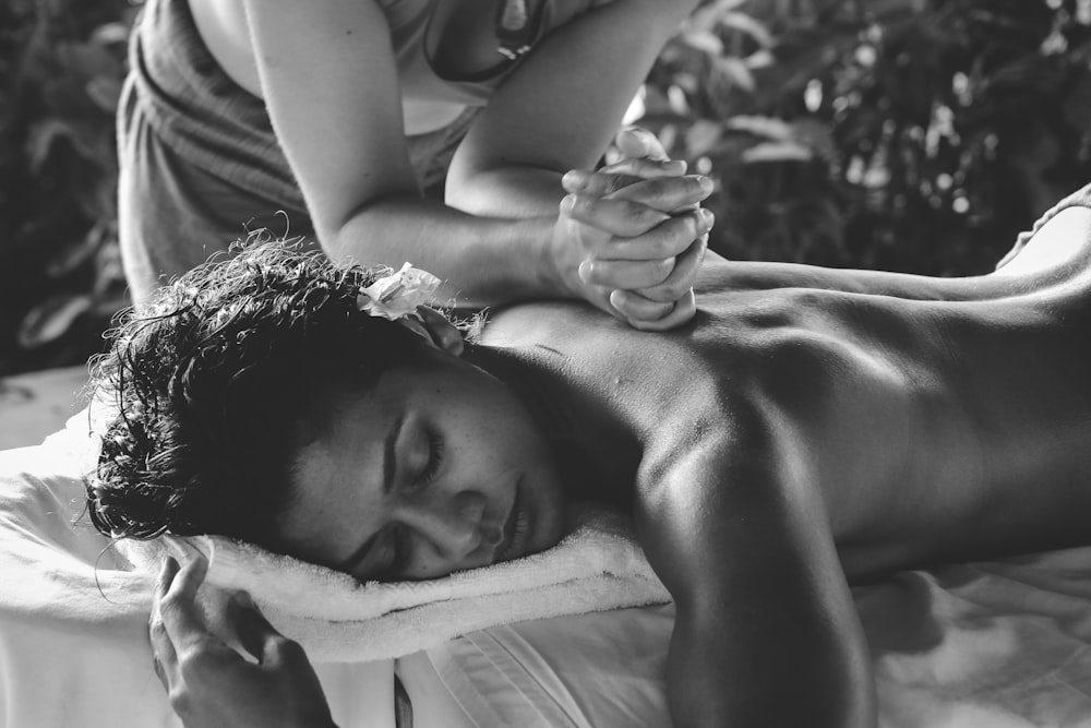 A woman getting a back massage as part of non-surgical body sculpting