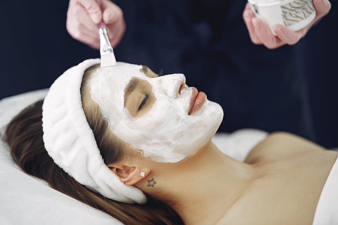 Woman with white facial mask